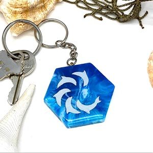 Dolphin resin keychain dangler. Geode shapes blue and white